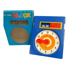 Vintage Clock Learn to tell the Time. Play-time with concealed window to reveal 