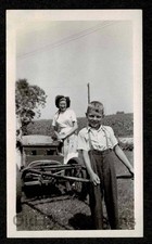 BOY PLAYING HORSE DRAWN
