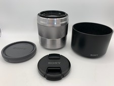 Sony E Mount 50mm F1.8 OSS Silver Lens front/rear caps + hood PRISTINE CONDITION