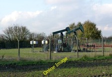 Photo 6x4 Nodding donkeys Gainsborough/SK8189 Oil well alongside Old Tre c2014