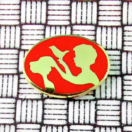 Gold tone child - bird, oval