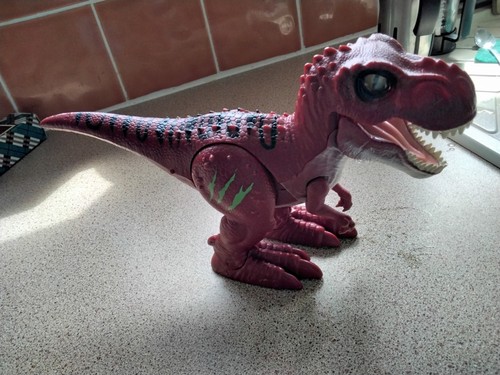 The red robotic dinosaur