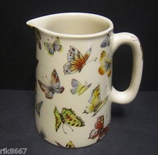 Heron cross pottery - cross, butterfly