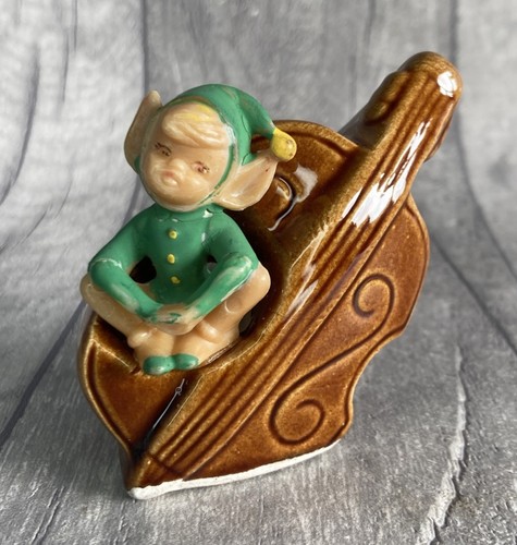 Vintage elf pixie sitting a - on,