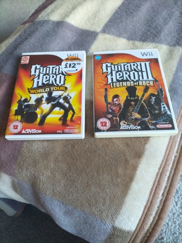 Two wii games - games,, guitar
