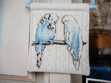 A LOVELY PICTURE OF A PAIR OF BLUE BUDGIES. CROSS STITCH CHART. FOR CHARITY ?