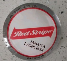 A Brand New Red Stripe Lager Round Frogeye T. Bar Badge