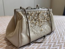 Hand-finished white clutch bag
