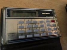 Sharp Elsi Mate EL-821 Credit Card Sized Calculator in wallet READ DESCRIPTION