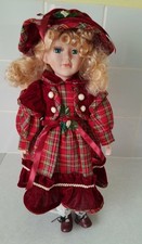 Porcelain doll . Check dress