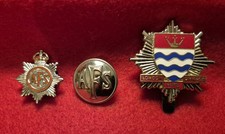 Obsolete badges and button. Auxilliary Fire Service and London Fire Brigade cap