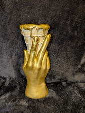 Ice cream. Gold hand ice cream cone. Dripping ice cream.