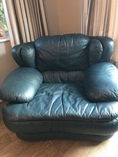 Leather Armchair 117cm Wide 107cm deep 81cm navy blue with matching footstool.