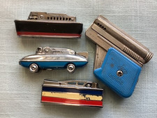Four Vintage Petrol lighters by IMCO, SAROME & Ribbon Line