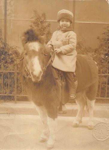 Antique young boy riding - young,