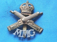 WW1. The Motor Machine Gun Corp cap badge.