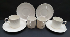 A set of 4 Aynsley white fluted bone china coffee cups and saucers 1920s