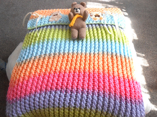 Hand knitted rainbow bear - hand,