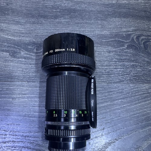 Canon new 200mm 8 lens - new, fd