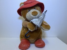 Raindrops keep falling on my head singing and swaying Beverly Hills teddy bear