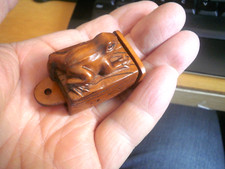 Hand Carved wood netsuke of a