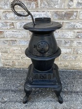 Antique umco pot belly cast - umco,