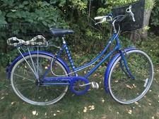 Raleigh Chiltern functional city bike with two baskets and stand