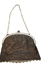 Chain mail 1920's bag/purse with a pale pink lining decorated with tiny flowers