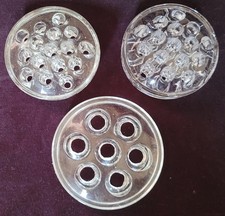 Three vintage glass flower frogs - 7 and 2 x 16 holes