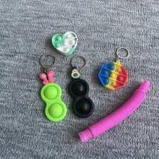 Pack of 5 pop its and fidget toys very cheap some have keychains ! sensory