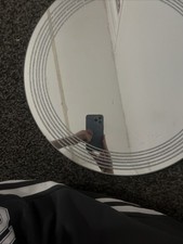 A Round Mirror With Glitter
