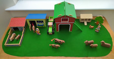 Wooden toy farm with handcrafted wooden animals and tractor