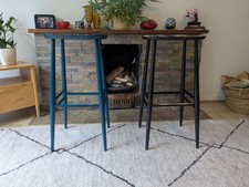 Pair of Ercol tall mid century modern bar stools, one black, one blue