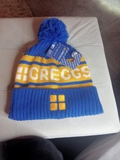 GREGGS BLUE YELLOW BOBBLE HAT