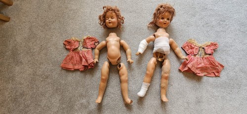Two matching antique doll
