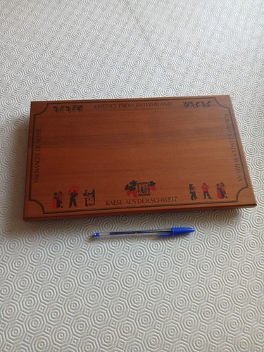 Wooden cheese board with swiss - wooden,
