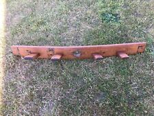 Oak coat rack made from the stave of a retired whiskey barrel