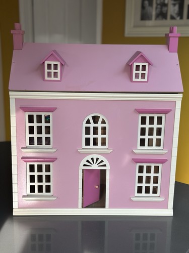 Pink wooden dolls - house, with