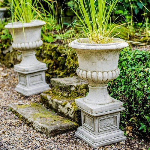 Pair medium stone cast urn - of,