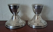 Pair of small hallmarked silver candlesticks by Broadway & Co.