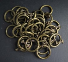 32 EARLY 20TH CENTURY FRENCH CAFÉ CURTAIN GRIPS WITH BRASS CURTAIN RINGS