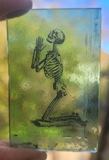 Stained Glass Skeleton paying
