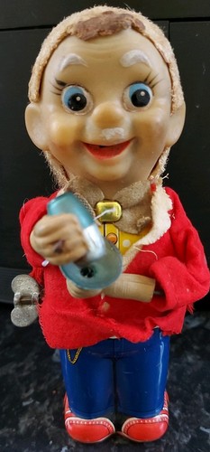 Vintage wind metal tin toy - up,