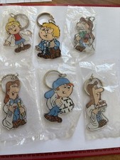 Six Tetley Tea Folk Key Rings. 