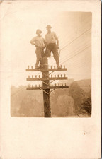 Telephone Linemen Standing on