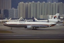 Original 35mm colour slide of leased Malaysia Airlines MD-11 N273WA at HKG