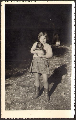 Kid girl holding little - , dog