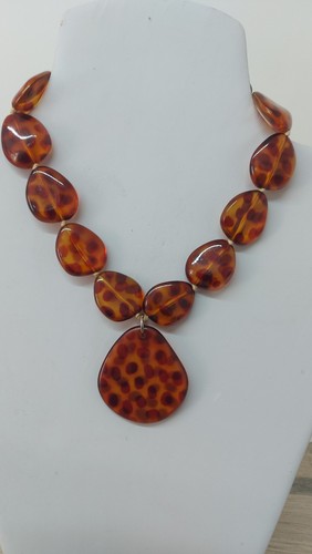 Amber coloured spotty resin - amber,