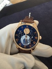 POEDAGAR Moonphase men's quartz watch with a brown leather strap.