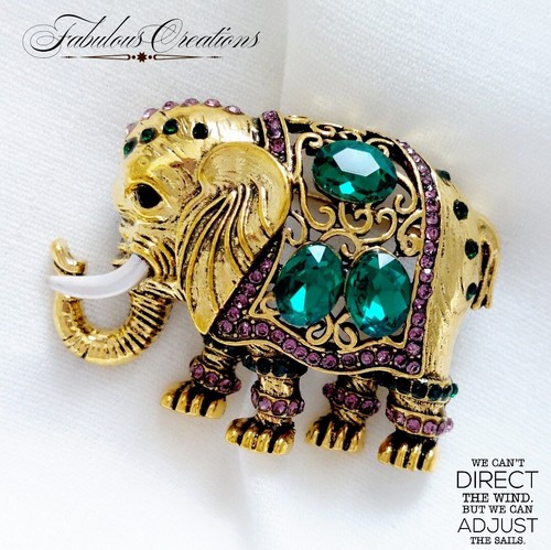 Gold tone elephant brooch - tone,